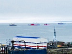 The floating nuclear power station Akademik Lomonosov escorted by an ice boat and tow boats has approached the city of Pevek